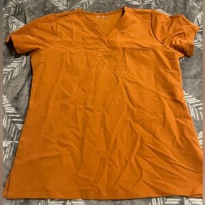 Burnt Orange mandala scrubs. Top is medium. Bottom is medium Tall